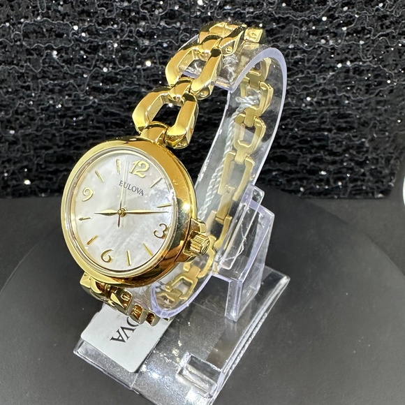 Women's (NWT) Bulova w/Mother-of Pearl Face, Gold Bezel, and Gold Chain Bracelet - Picture 2 of 5